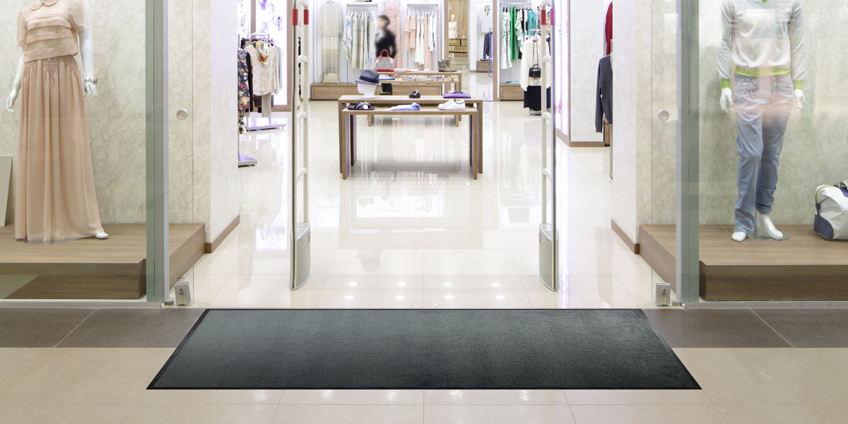 Monotone mat in front of shop entrance